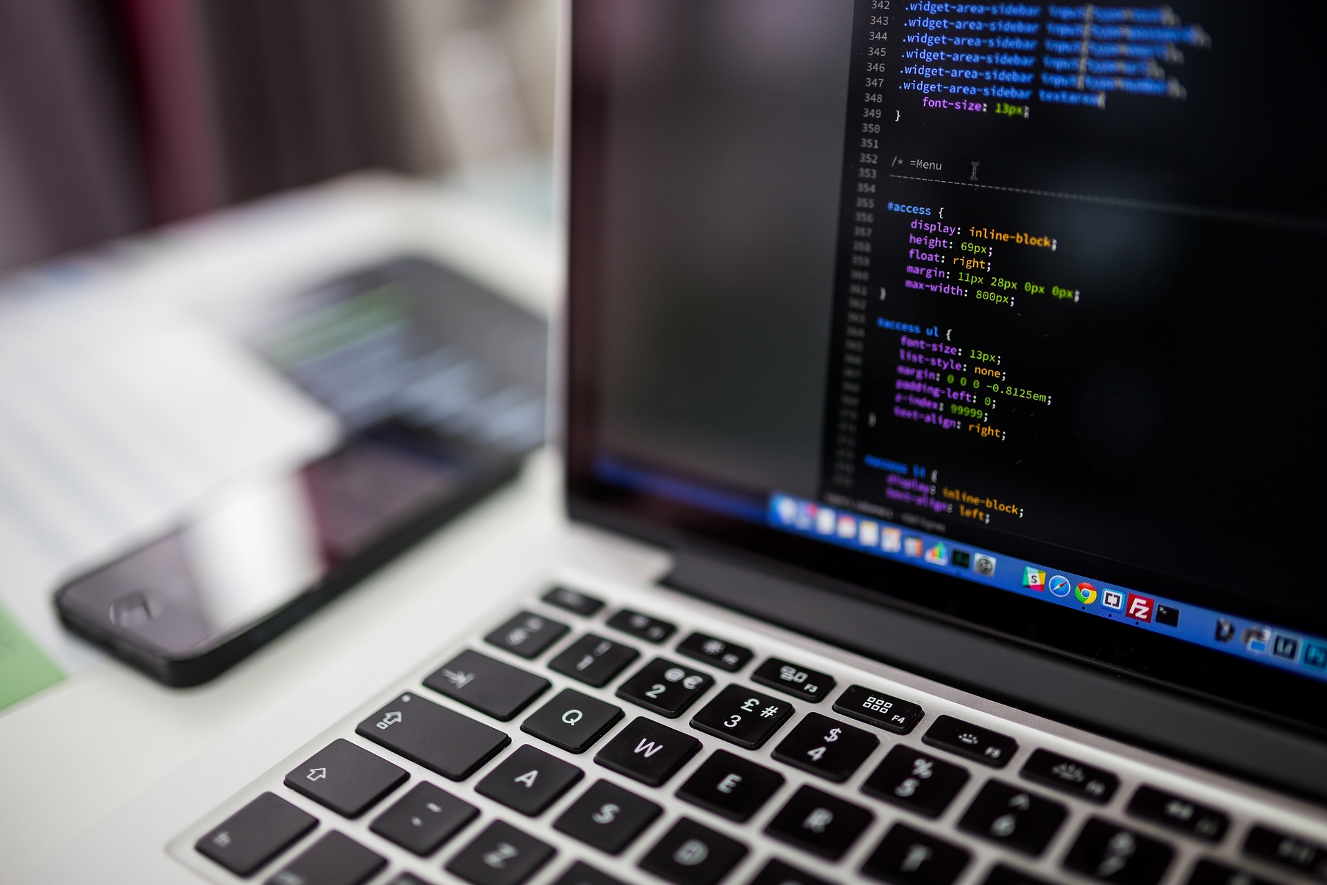 JPEG of a laptop with code on screen